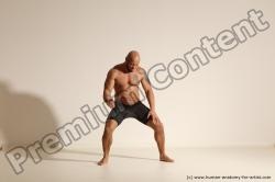 Underwear Gymnastic poses Man Black Muscular Bald Dancing Dynamic poses Academic